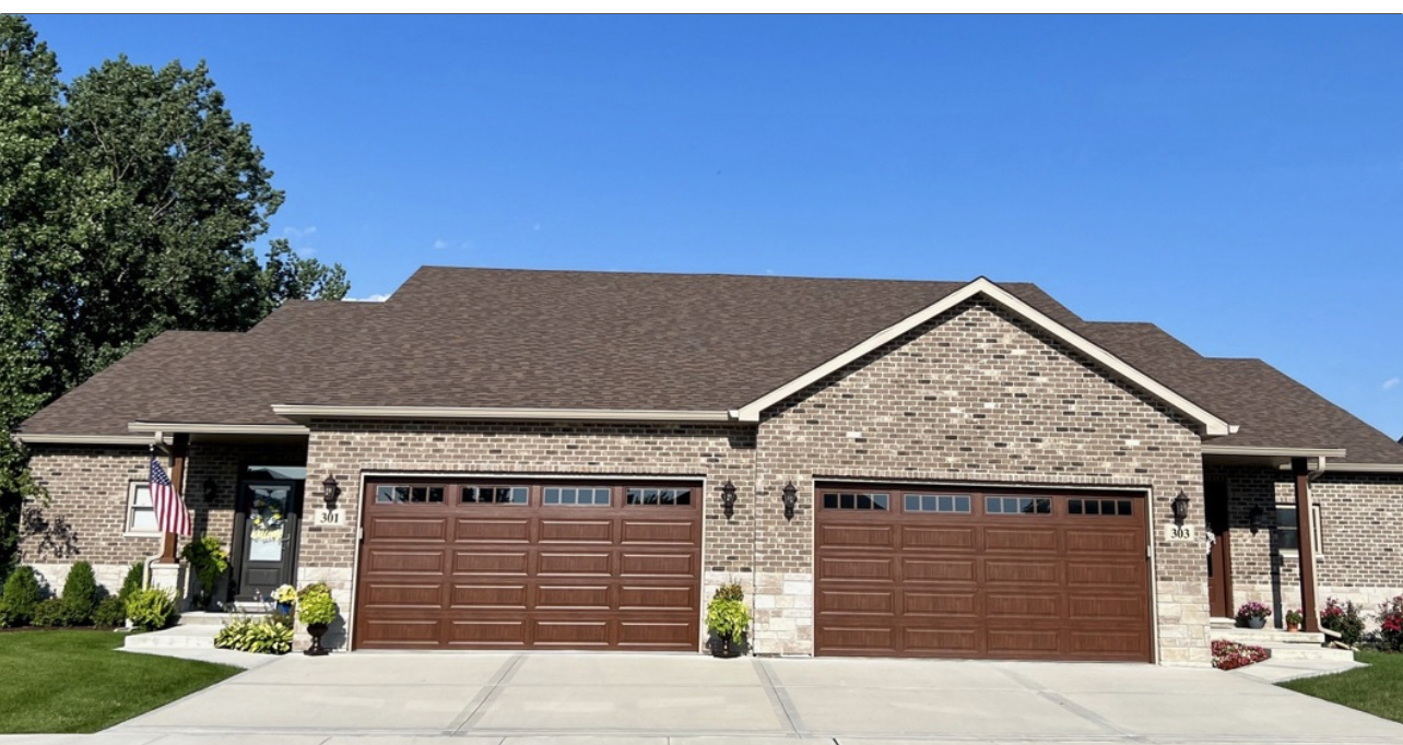 a front view of a house with a garage