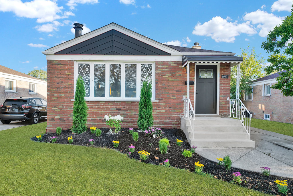 a front view of a house with garden