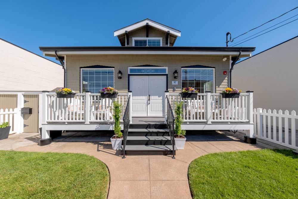 a view of a deck with a sink and a yard