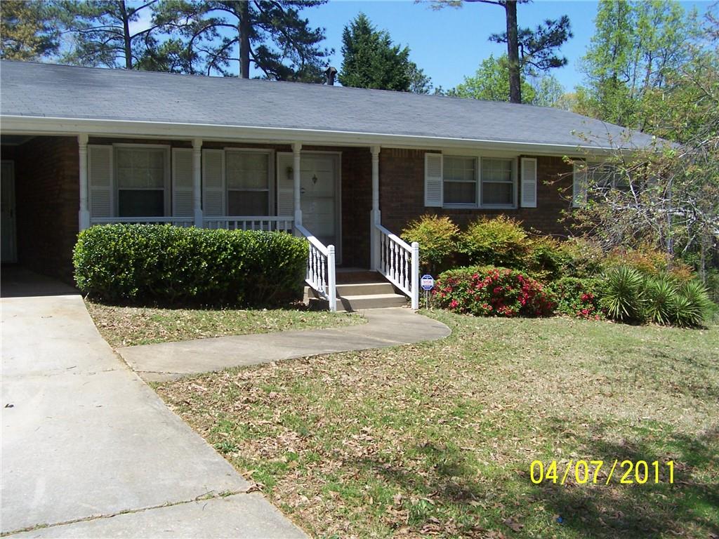 a view of a house with a garden