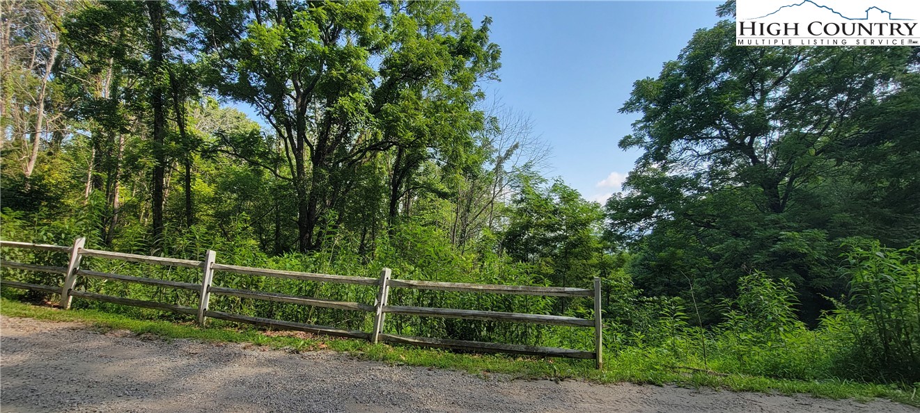 a view of a fence and a park