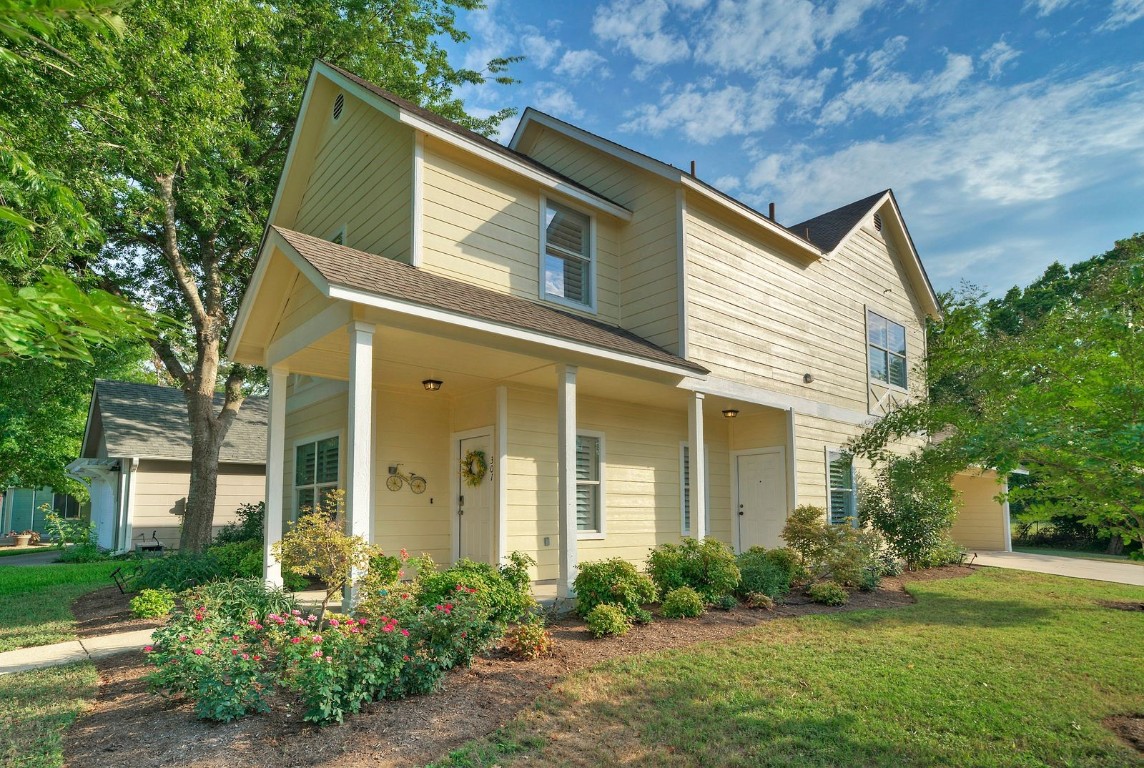 a front view of a house with garden