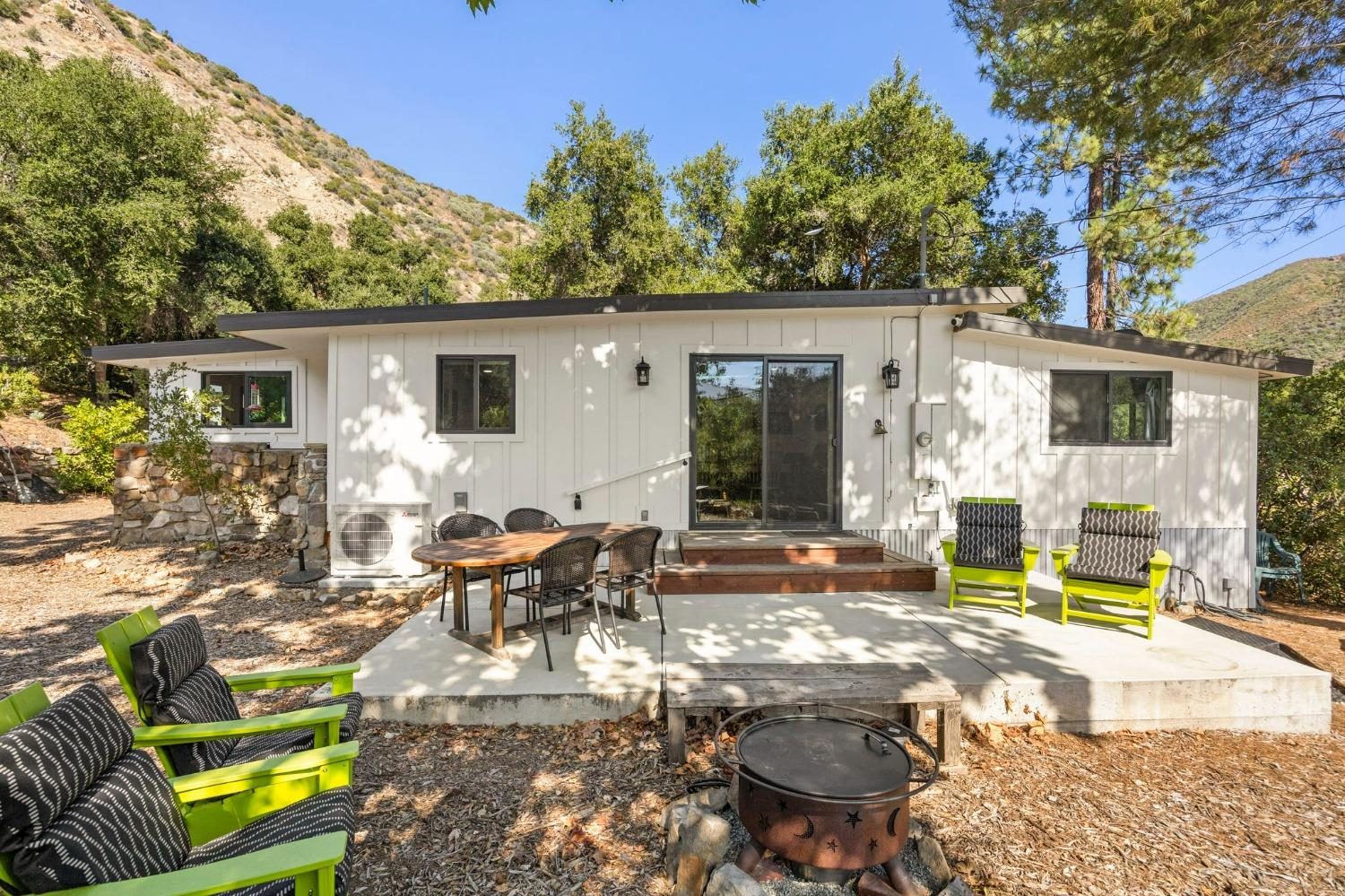 a view of a backyard with sitting area