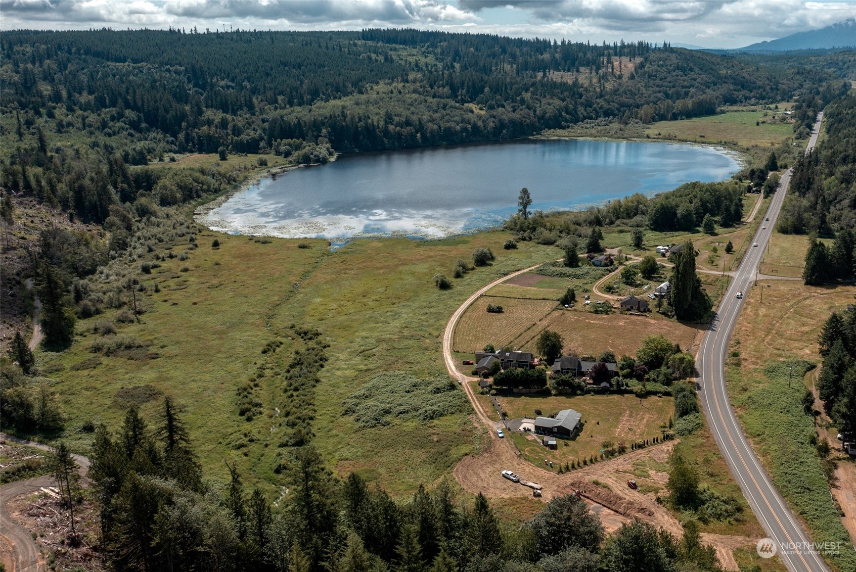 an aerial view of a house with a lake view