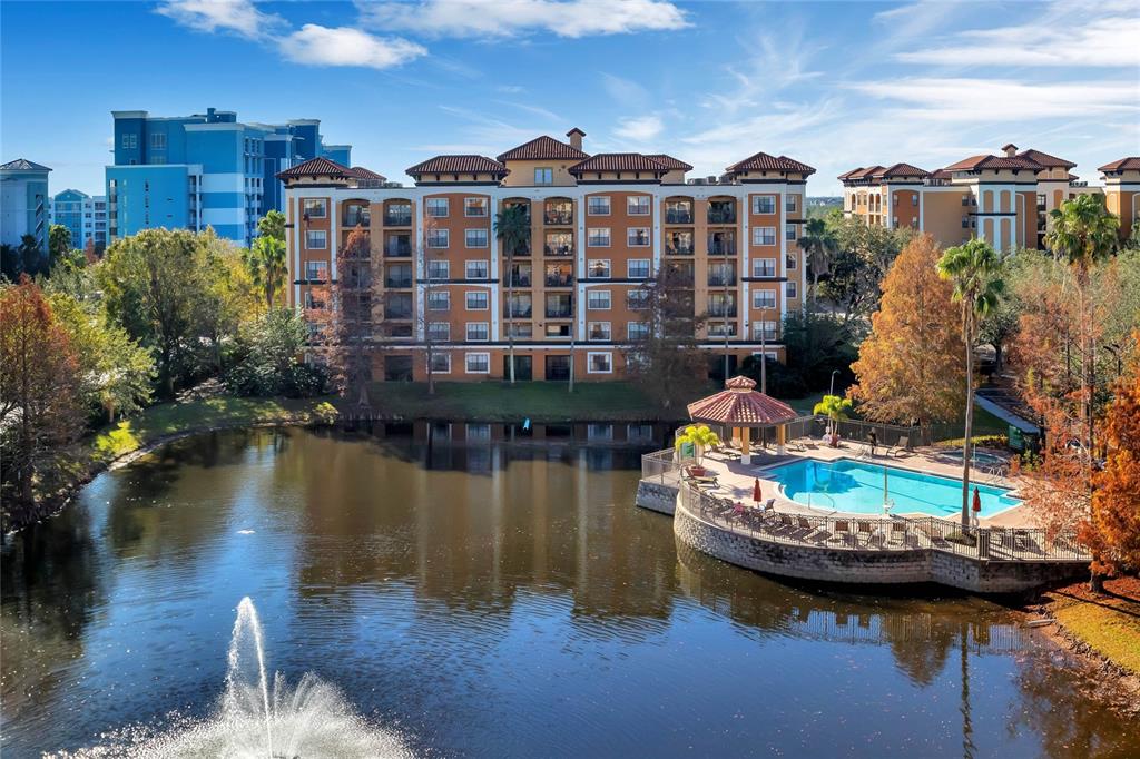 a view of a lake with a residential apartment building in the background