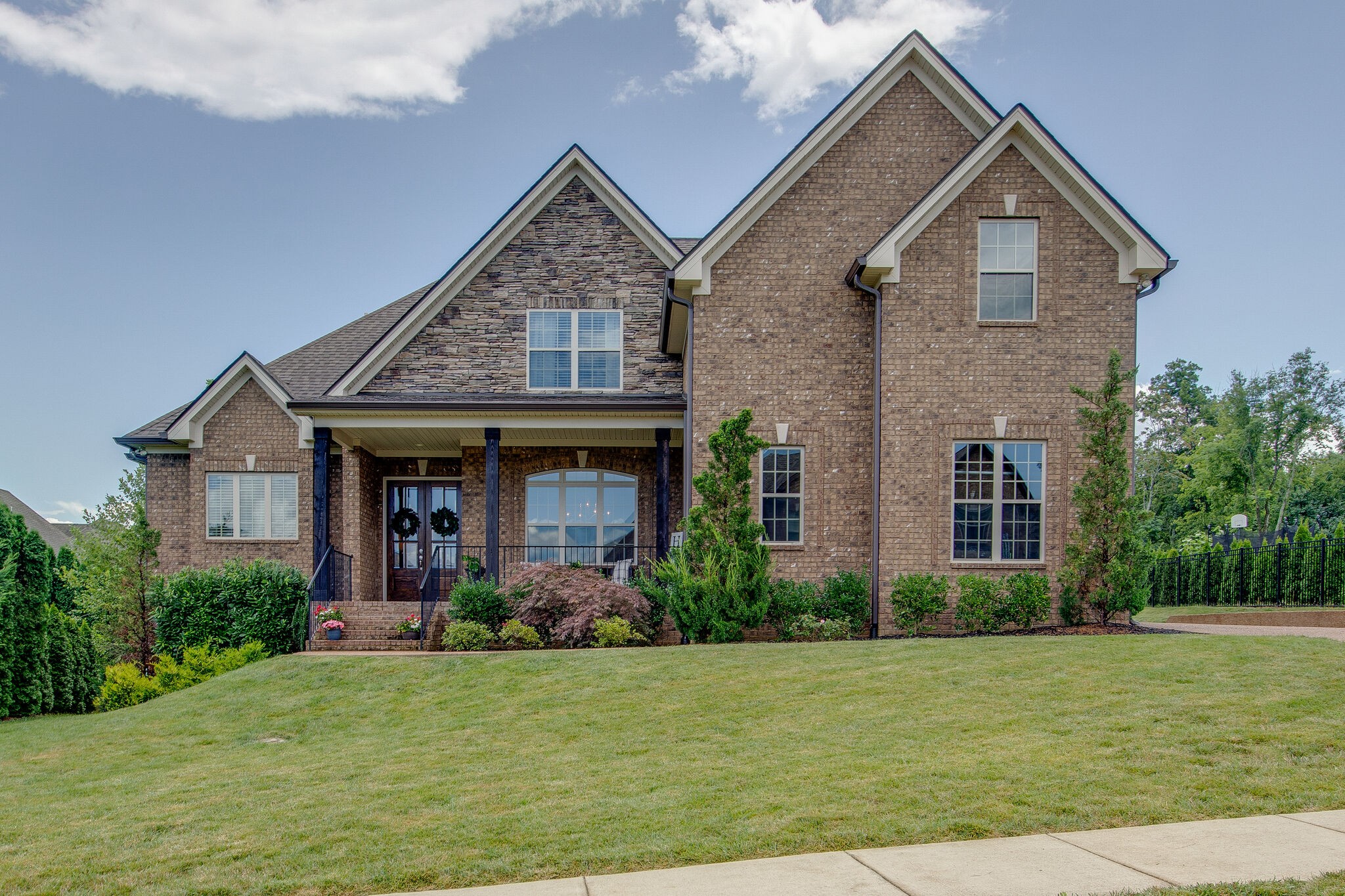 a front view of a house with a yard