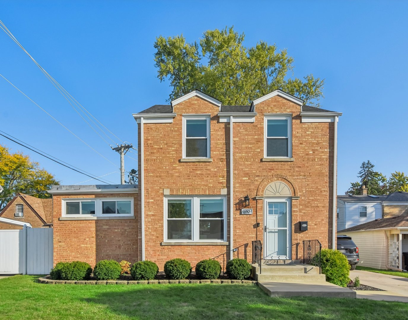 front view of a house with a yard