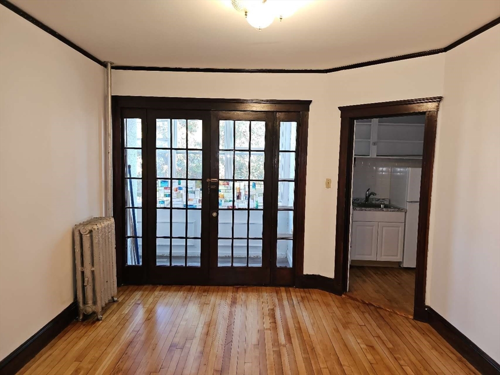 a view of front door with wooden floor