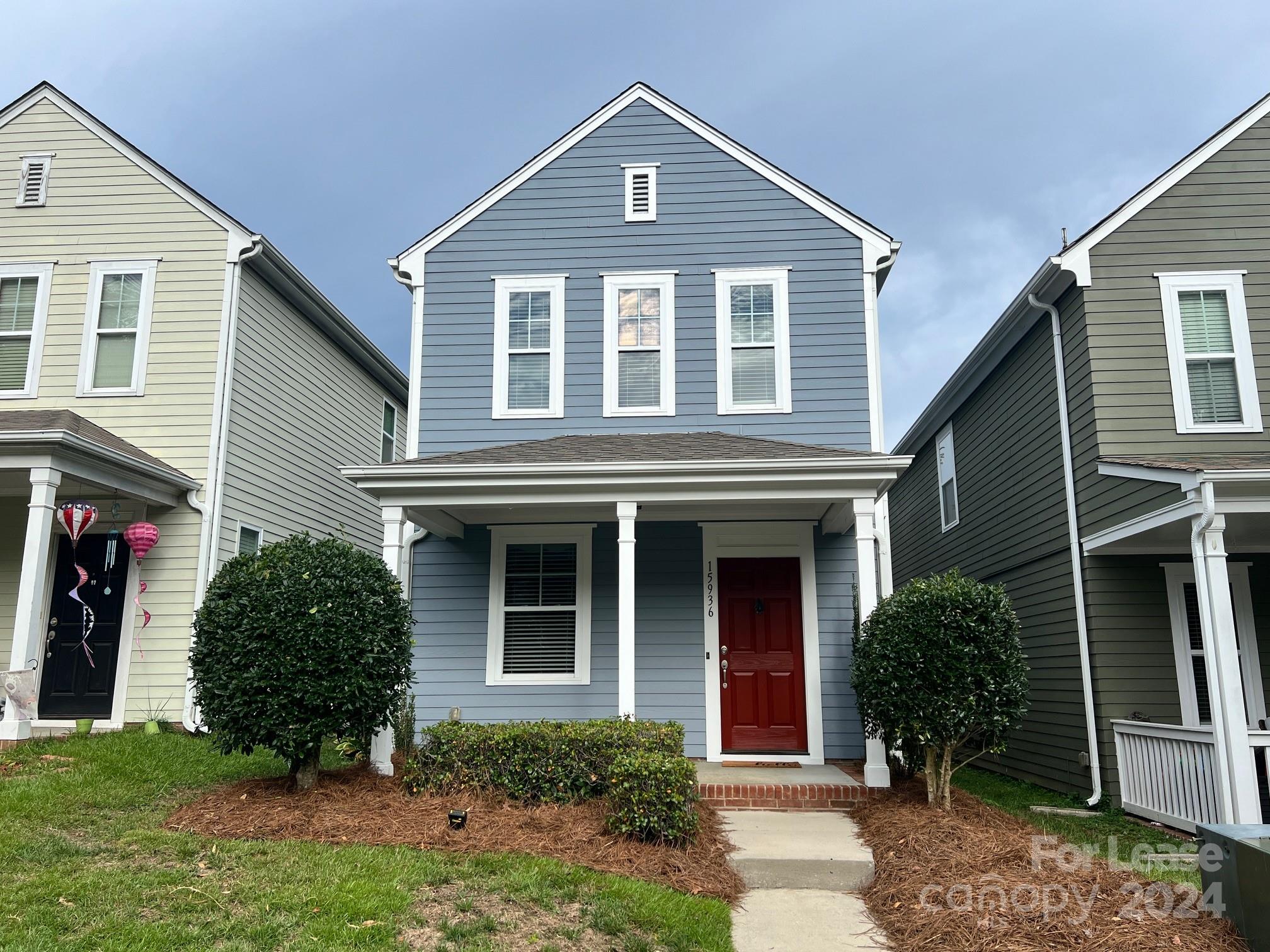 front view of a house with a yard