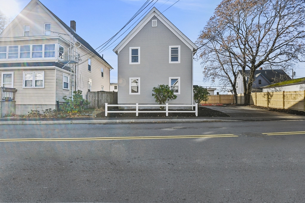 a view of a house with a street