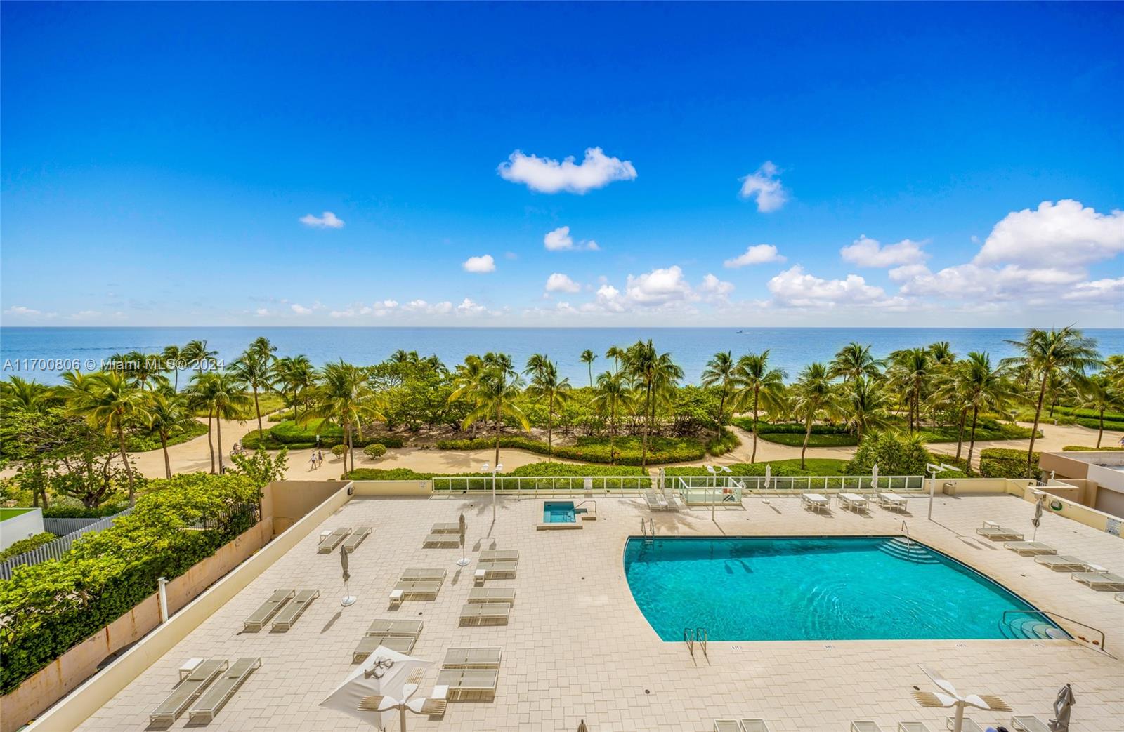 a view of an swimming pool and an outdoor seating