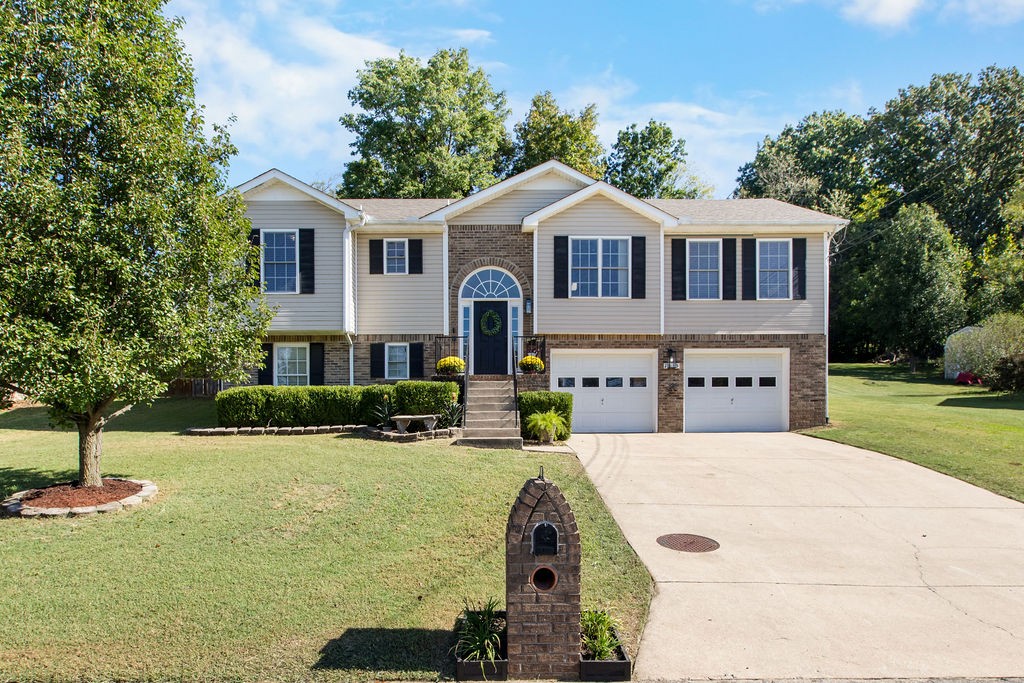 a view of house with yard outdoor seating and entertaining space