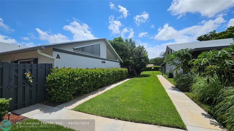 a view of a back yard of the house