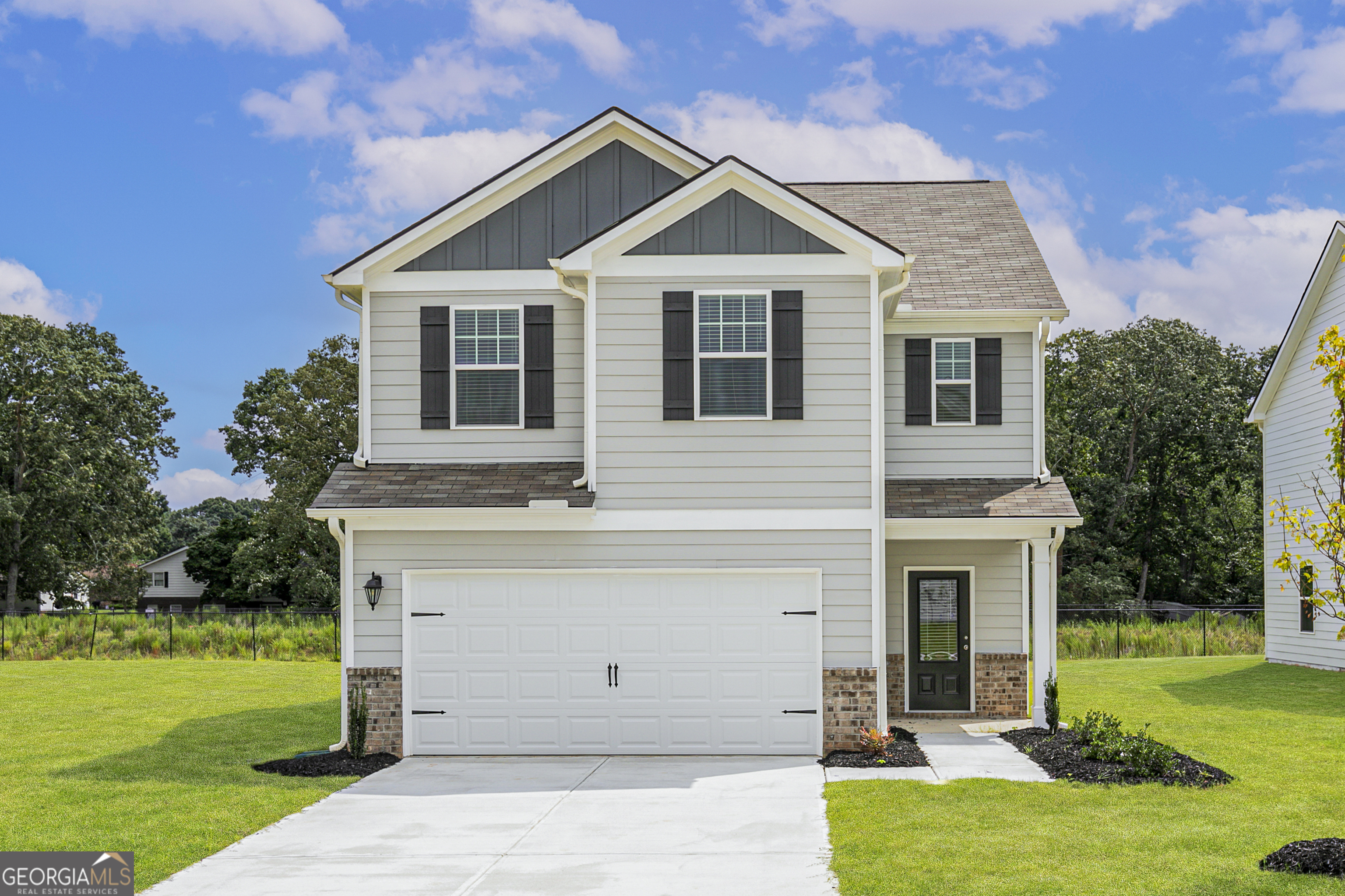 a front view of a house with garden