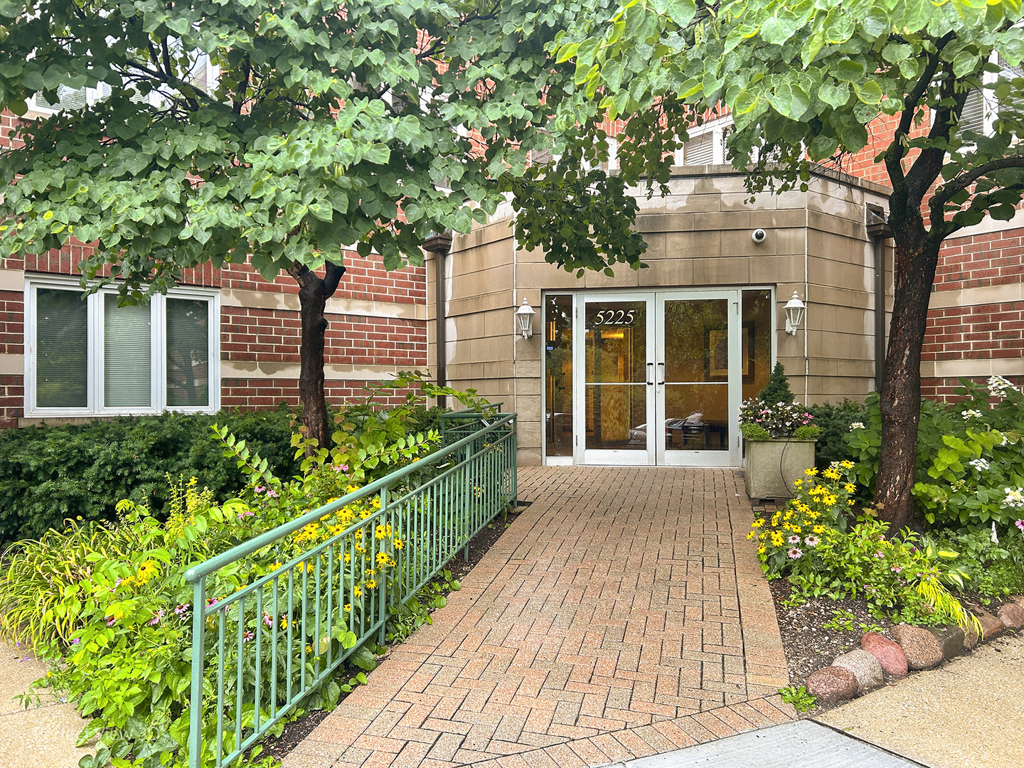 front view of a house with a garden