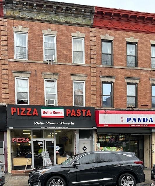 a cafe on the corner of a building