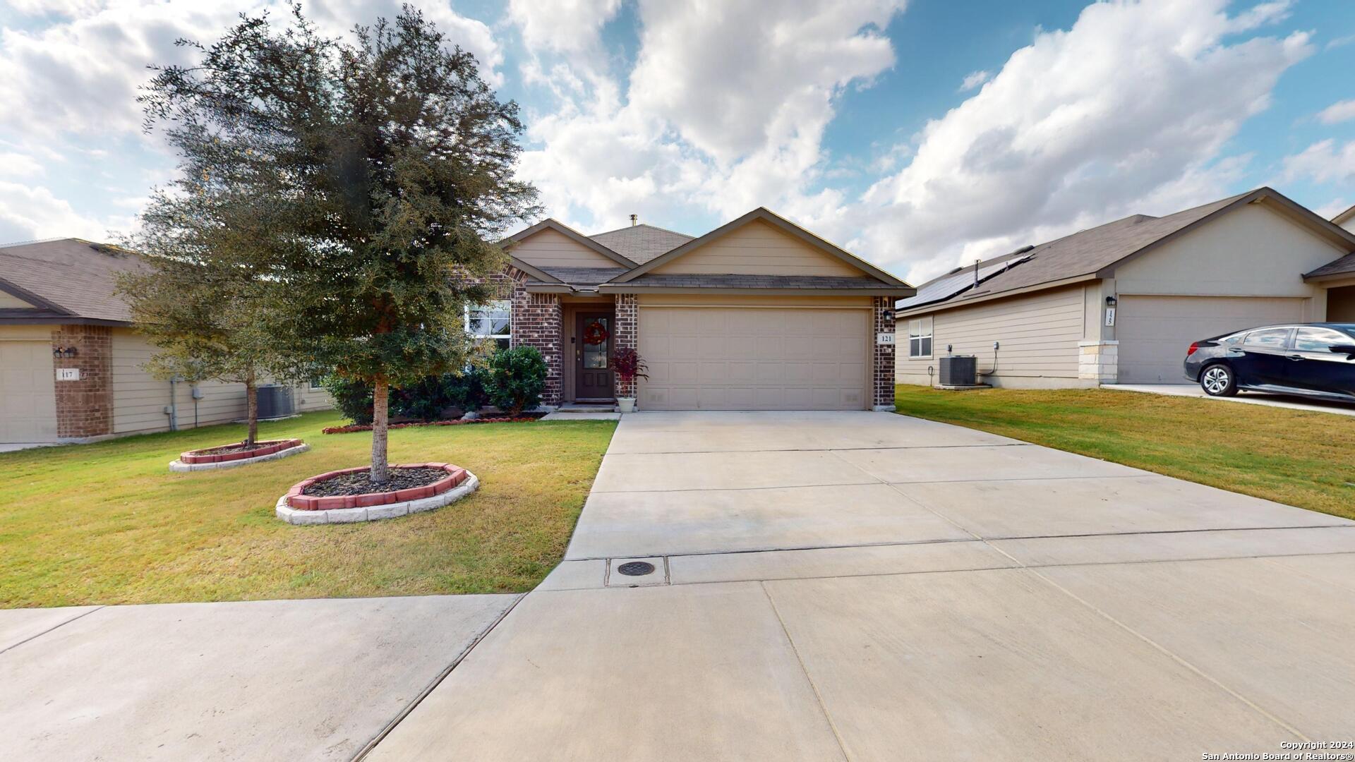 a front view of a house with a yard