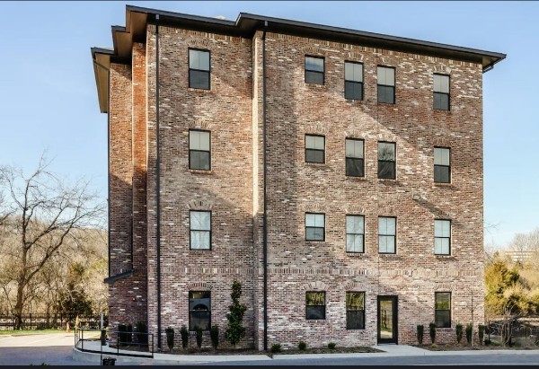 a front view of a building with glass windows