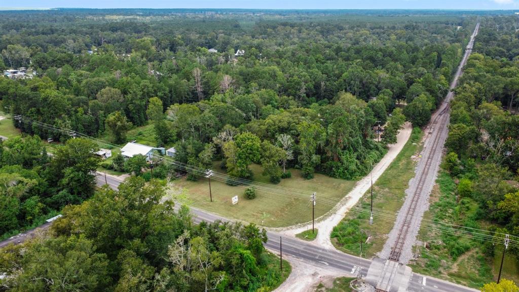 an aerial view of residential house with outdoor space and trees