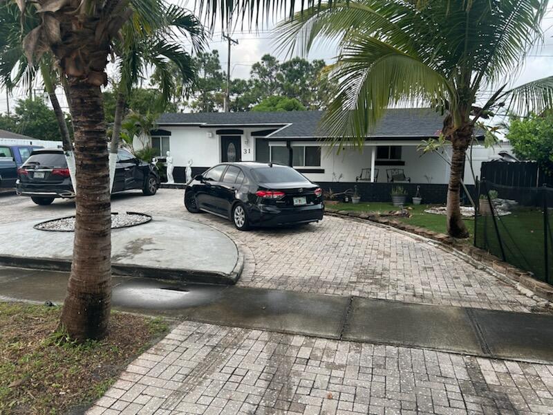 a view of a car park in front of house