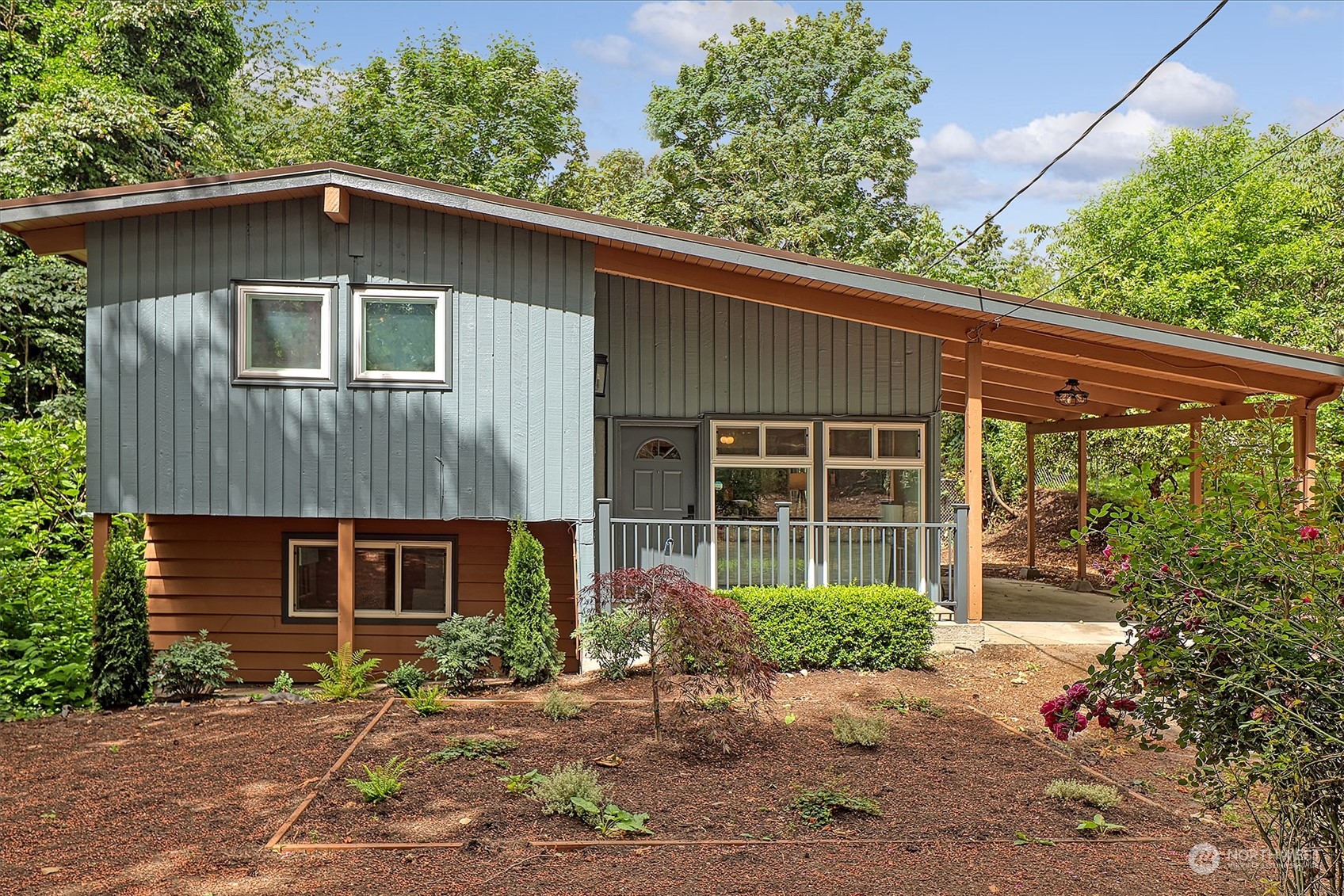 a front view of a house with garden