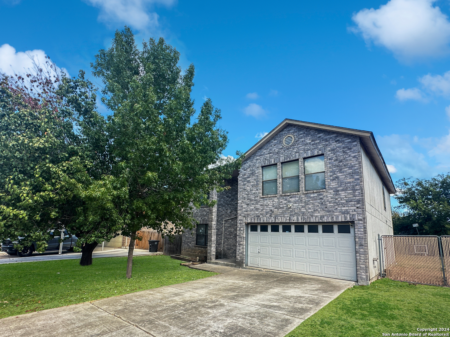 a brick building with a yard