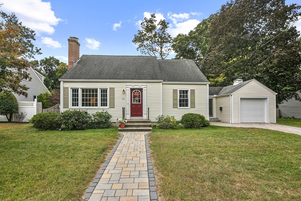 a front view of house with yard and green space