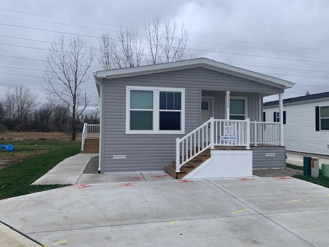 front view of a house with a small yard