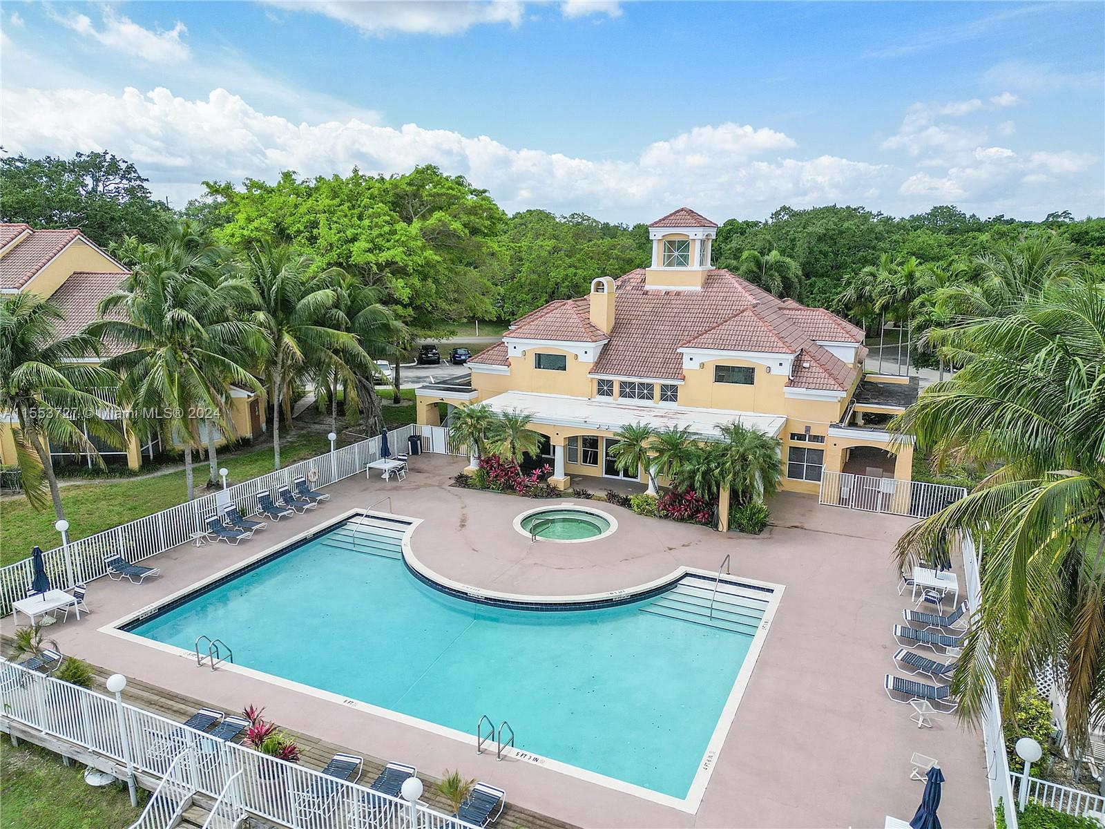 an aerial view of a house with outdoor space