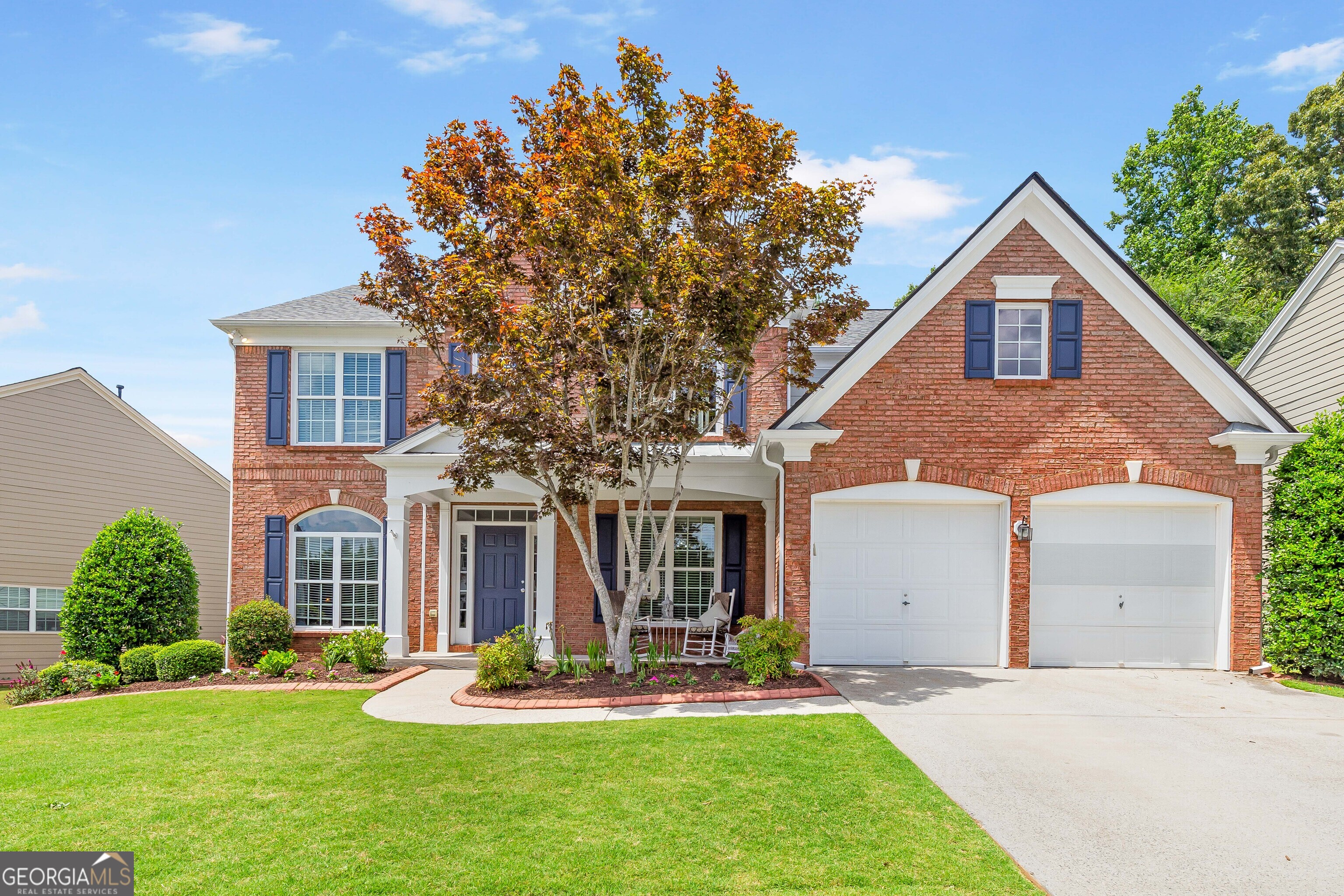 a front view of a house with a yard