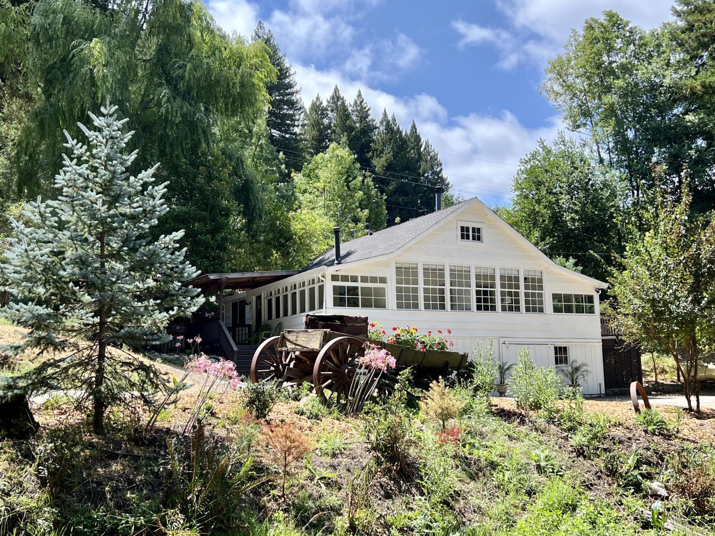 a front view of a house with garden