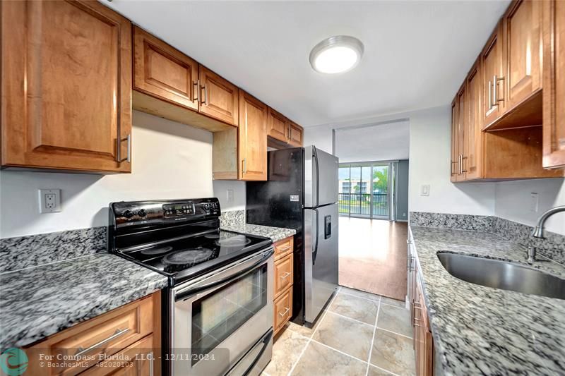 a kitchen with a stove and a sink