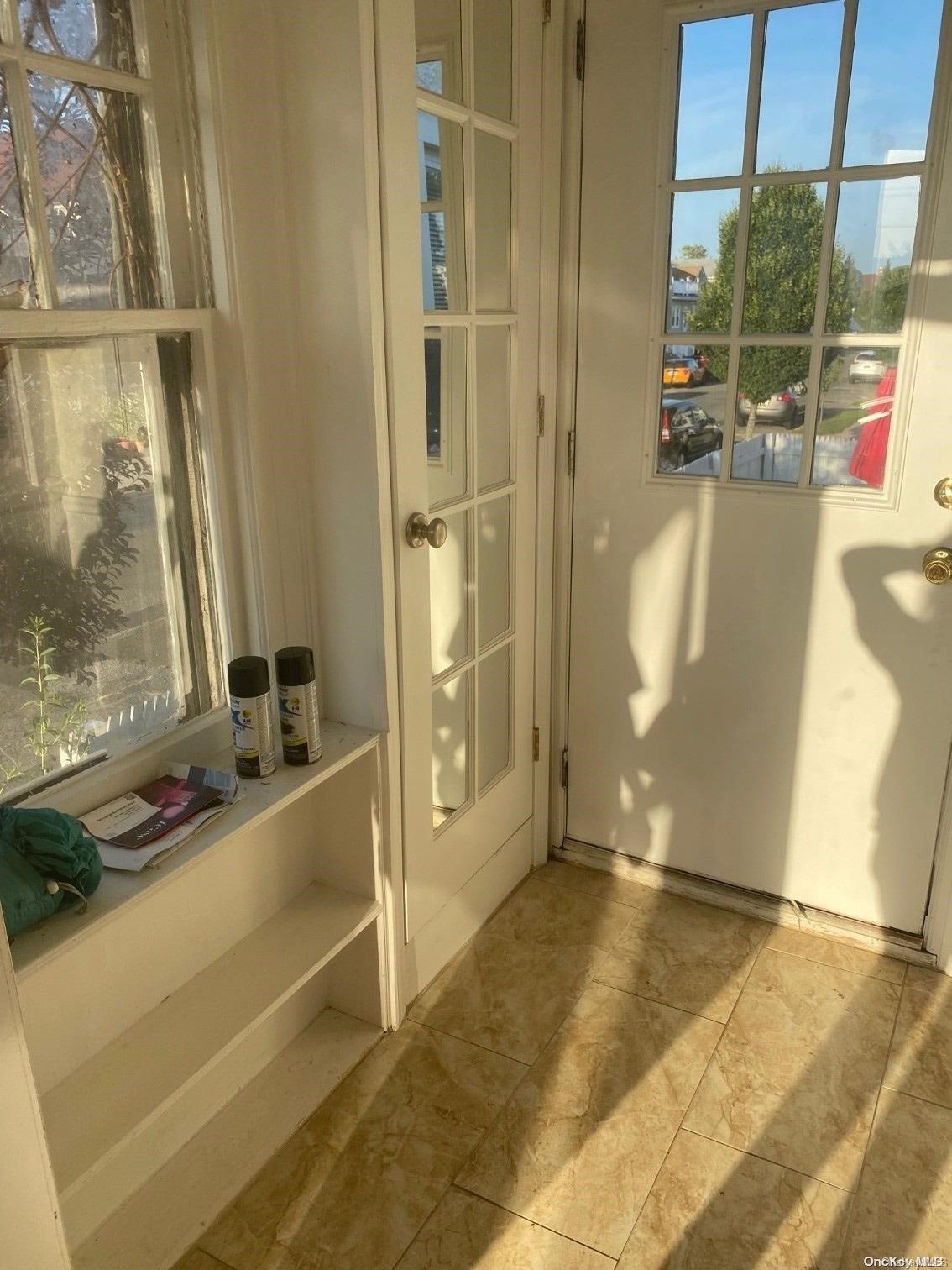 a view of a bathroom with a tub and shower