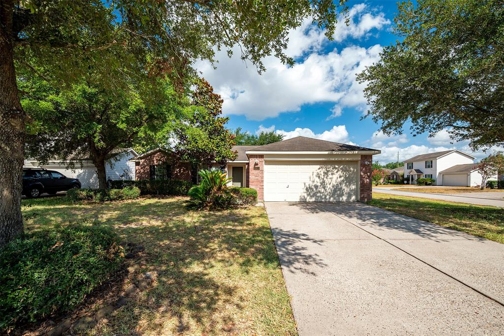 a view of a house with a yard next to a road