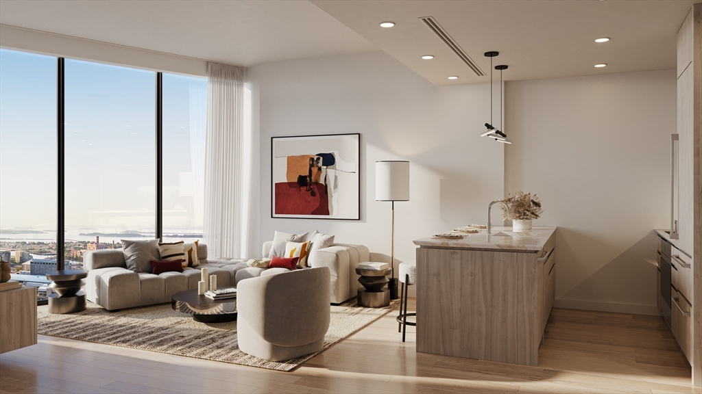 a living room with furniture a large window and a chandelier