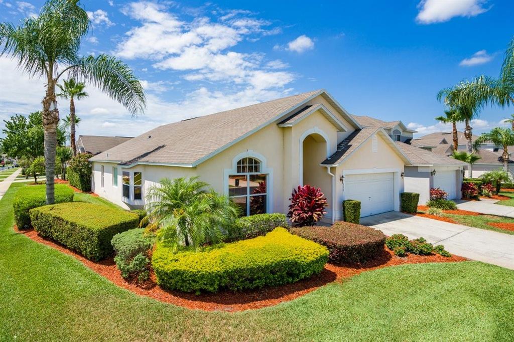 a front view of house with yard and green space