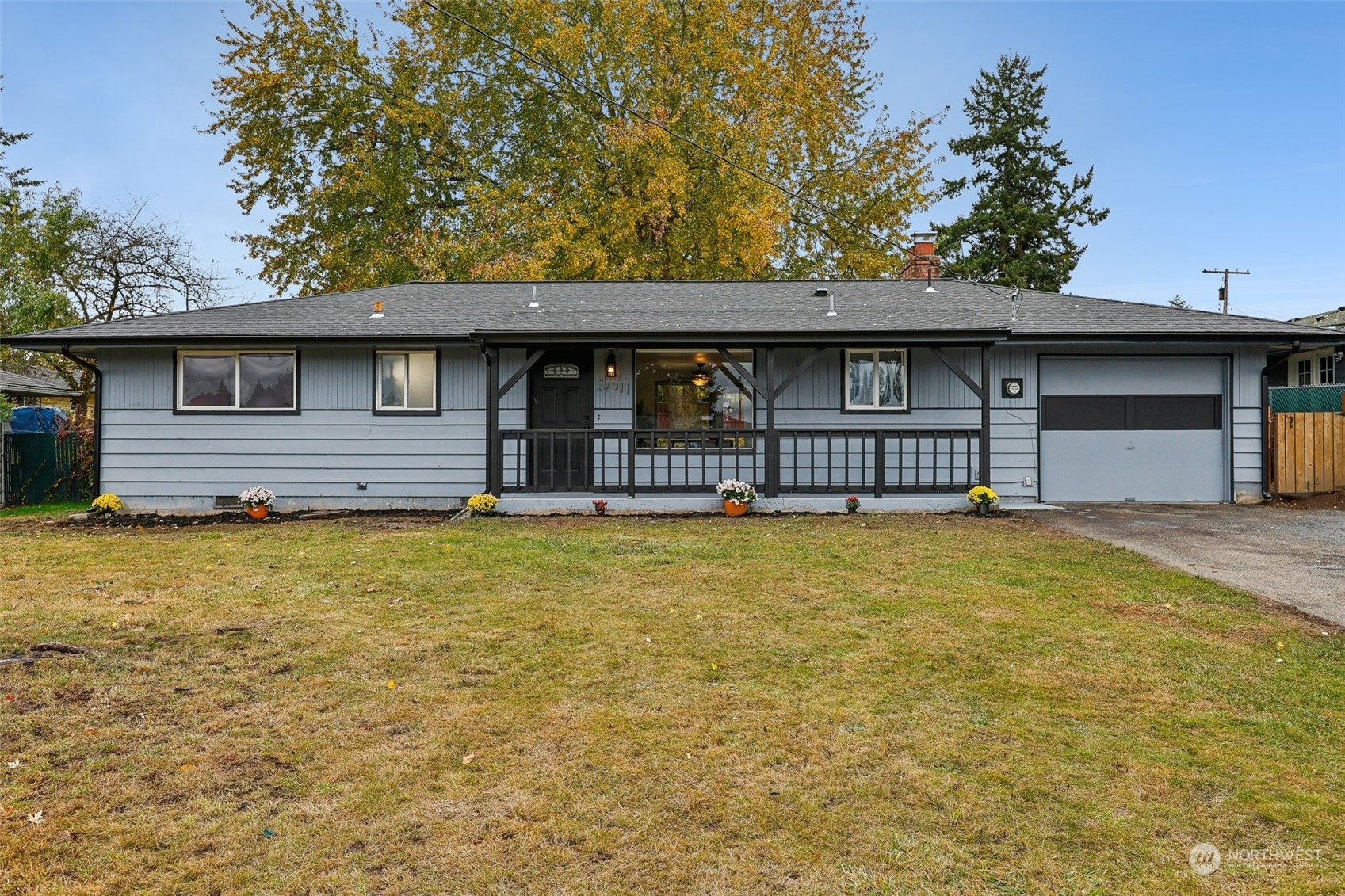 a front view of a house with a garden