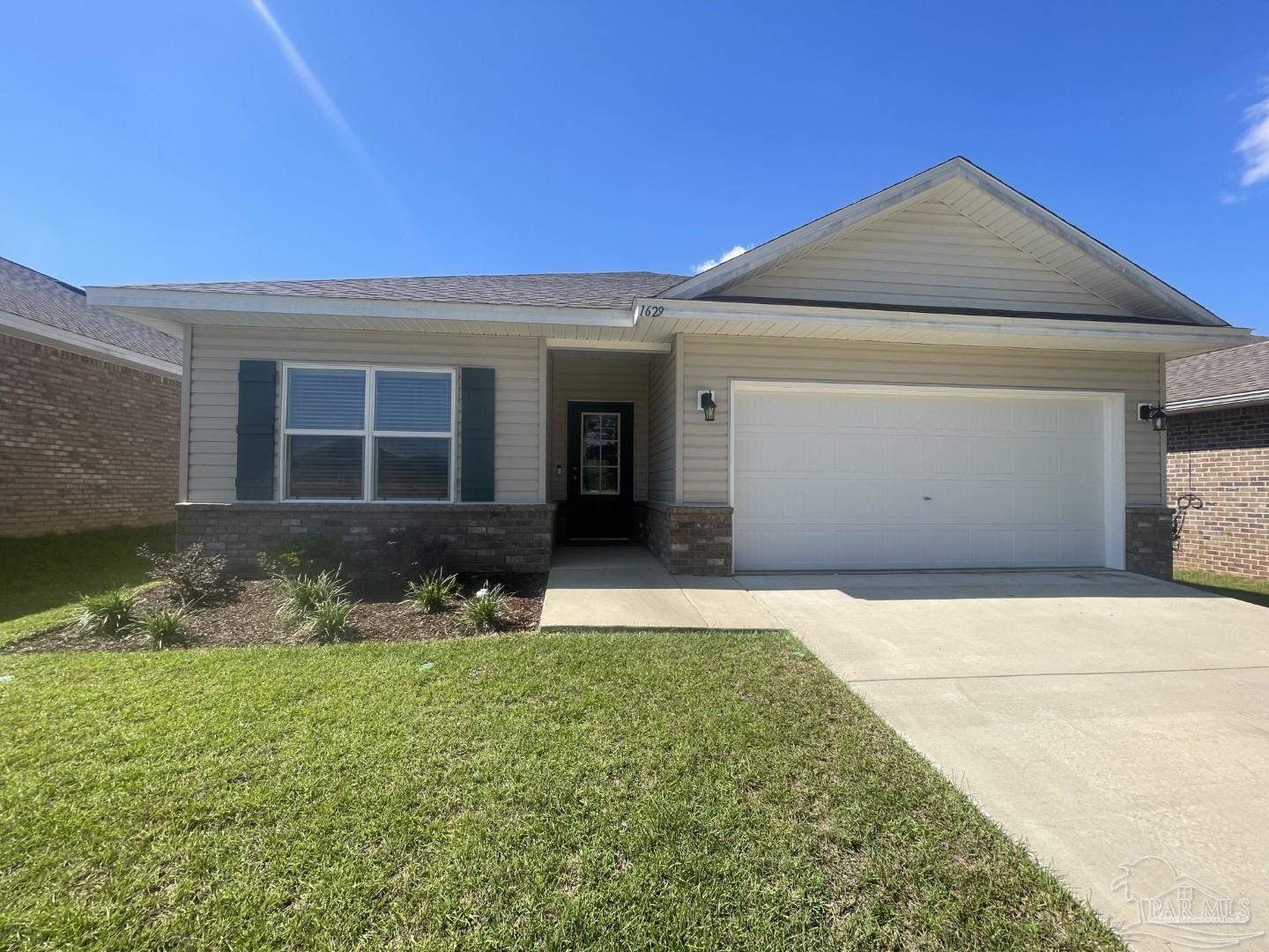 front view of a house with a yard