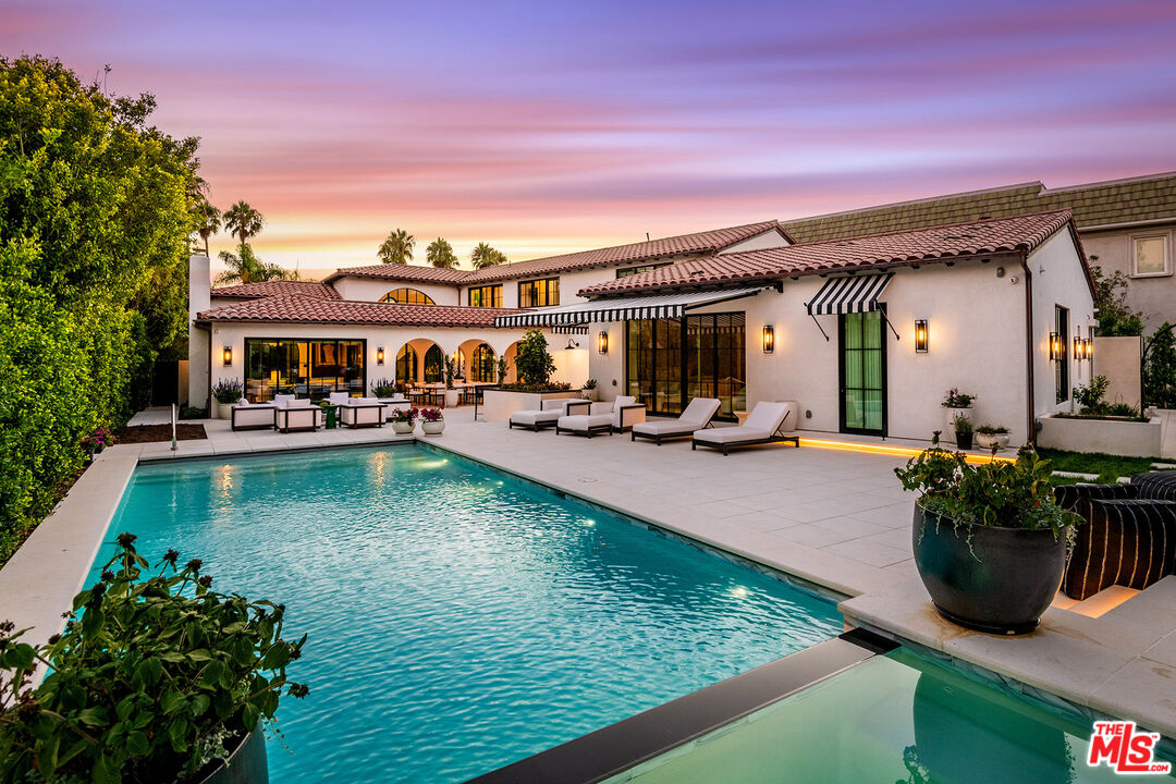 a view of swimming pool with outdoor seating