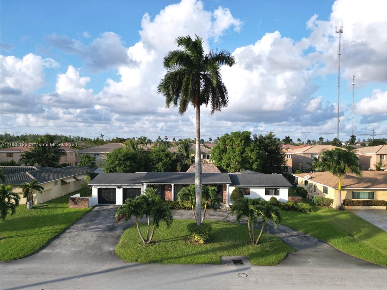 a view of a town with palm trees