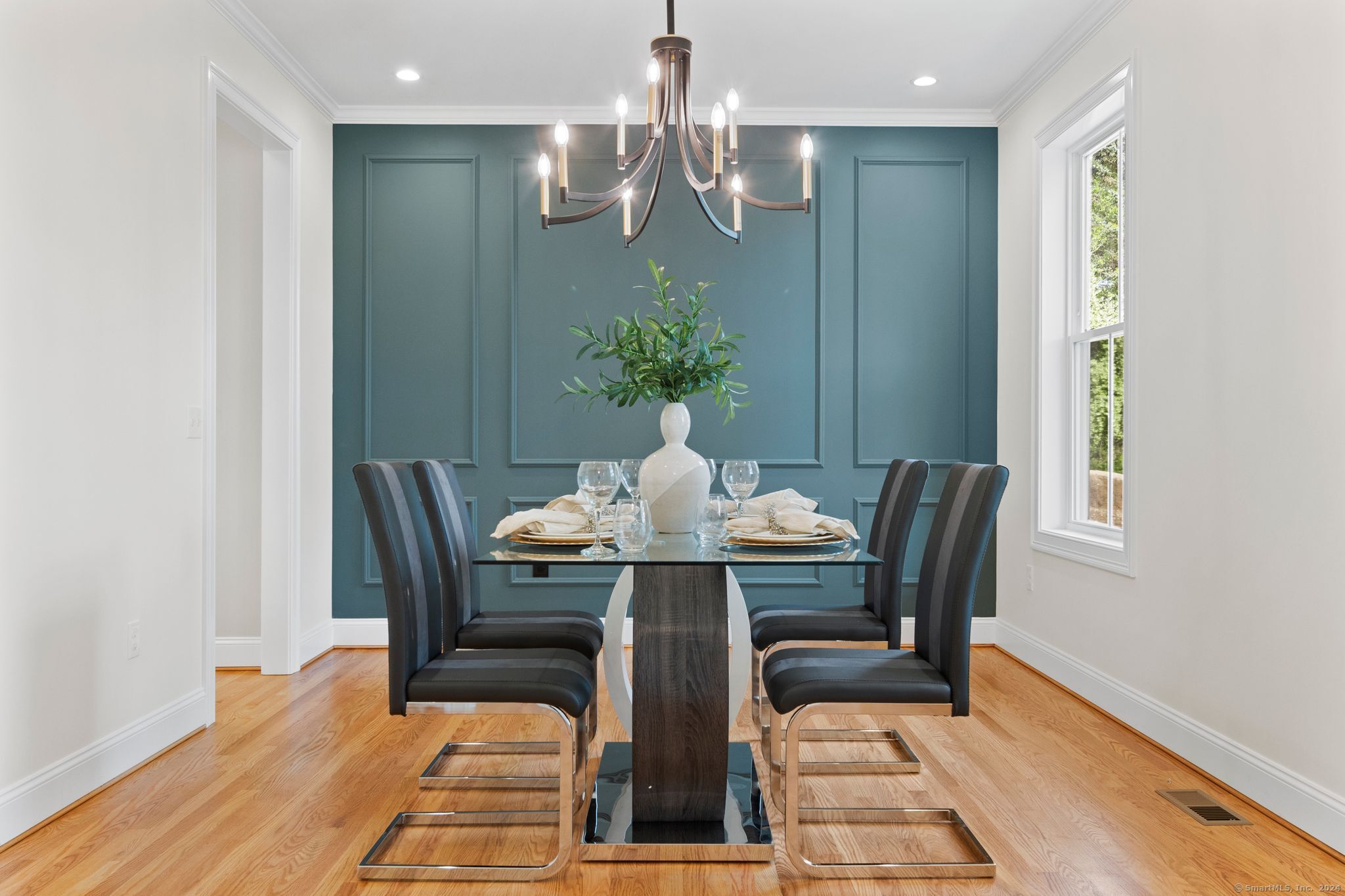 a view of a dining room with furniture and wooden floor