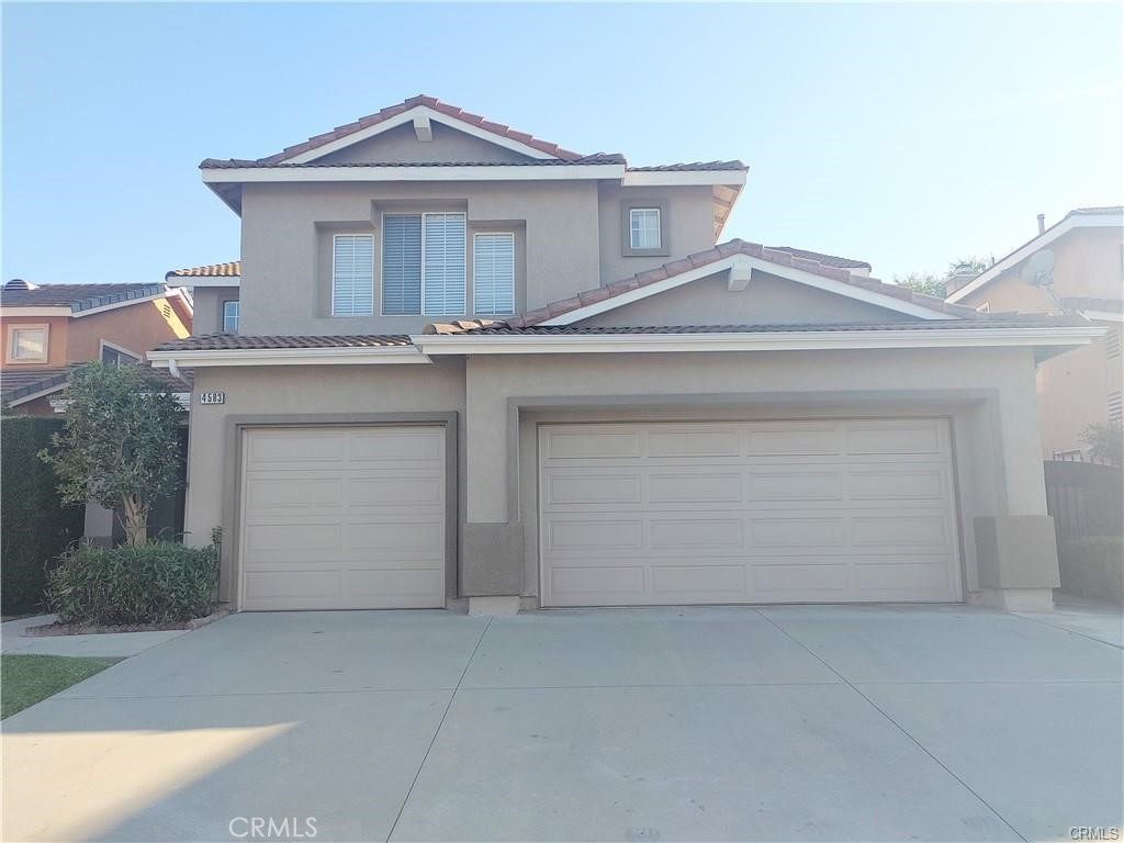 a front view of a house with a garage