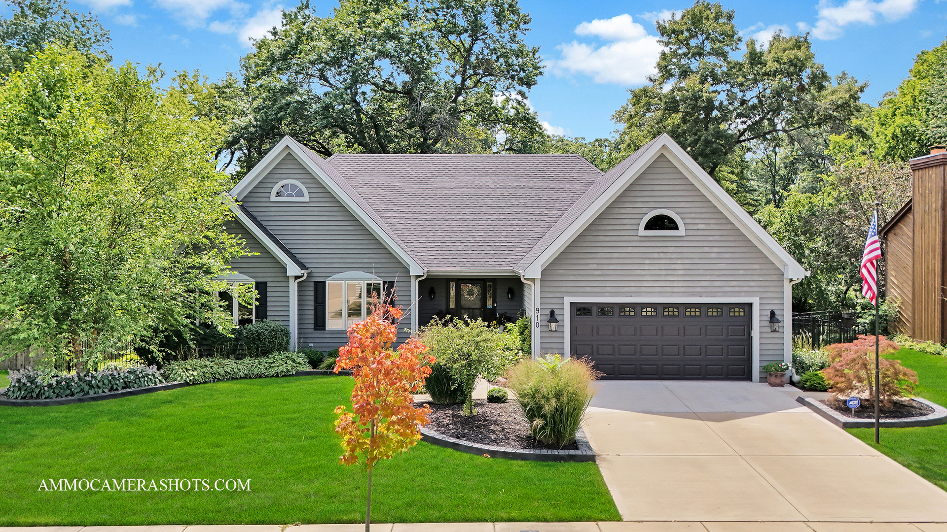 a front view of house with yard and green space