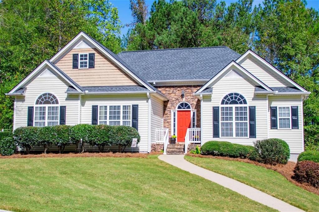 a front view of a house with a yard