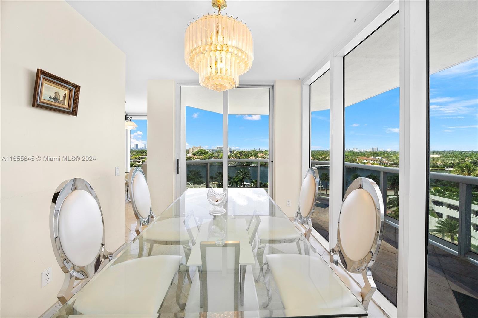 a view of a dining room with furniture wooden floor and chandelier