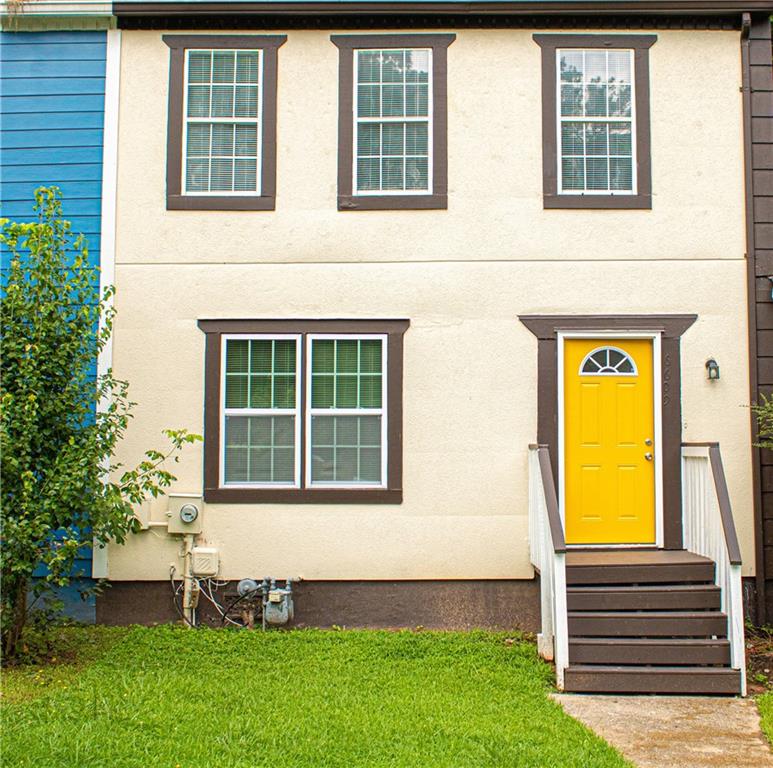 a front view of a house with a yard