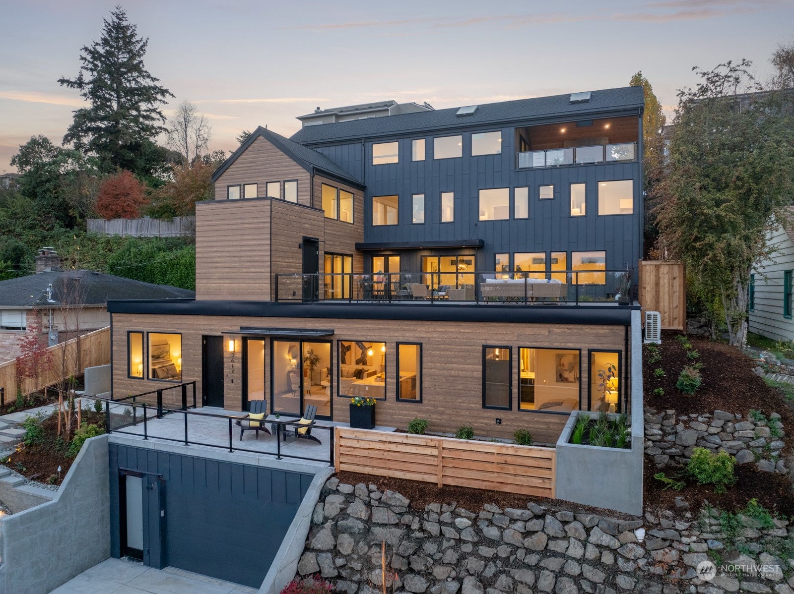 a front view of a house with outdoor seating