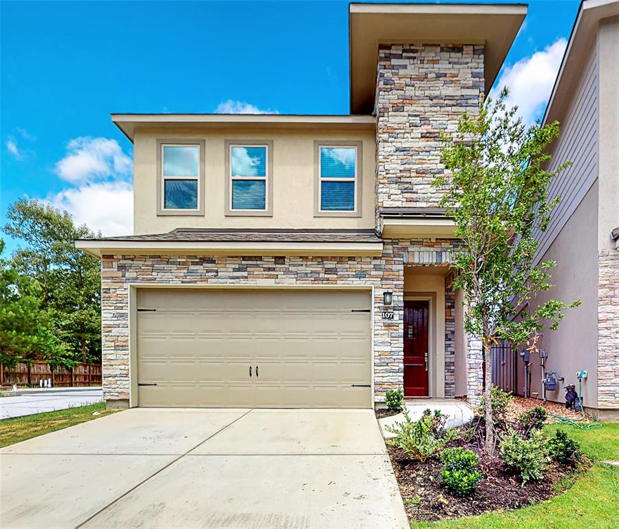 a front view of a house with a garage