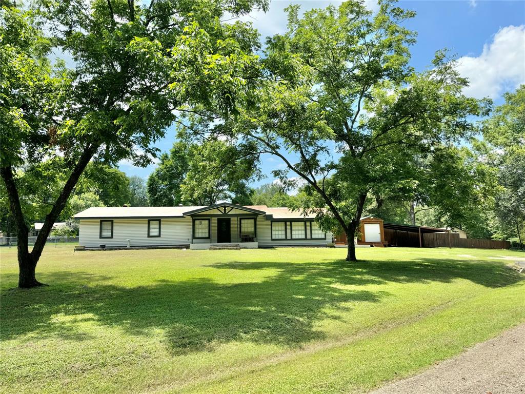 a view of a house with a big yard