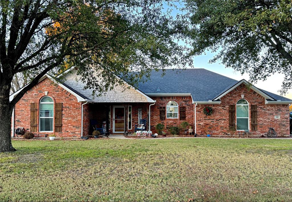 front view of a house with a yard